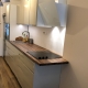Ikea High gloss creamy kitchen with timber benchtop